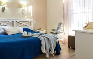 The master bedroom features a Double bed and the second bedroom contains 2 Single beds.