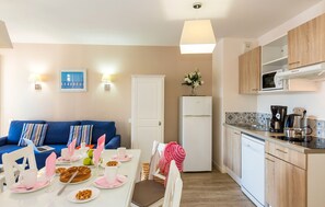 Prepare meals in the kitchenette and enjoy them at the dining table.
