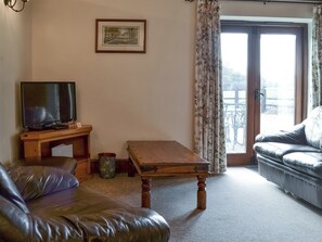 Living area with French doors to patio area | Baileys Barn - Moor Farm Stable Cottages, Foxley, near Fakenham