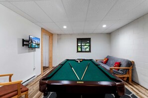 Pool Table and TV in Basement Area