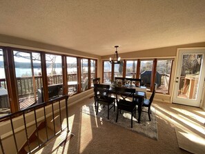 Large floor to ceiling windows provide a breathtaking view of the lake