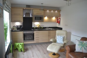 Kitchen area with all the facilities you will need, including TV and fibre wifi