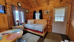 daybed/lounge with door leading to deck.