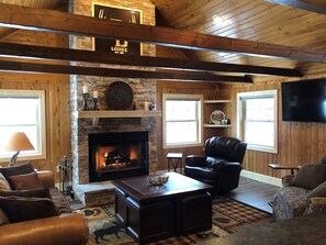 A nice fire and great glass of wine awaits.  Of course, there is a huge TV too. 
