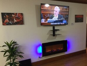 Nice size living room with the new 55" Smart TV and Electric Fireplace