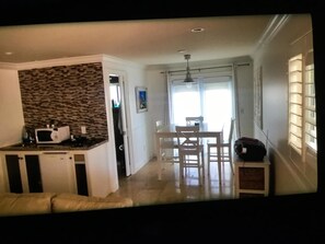 kitchenette  and dining area over looking the water
