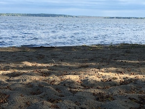 Beach area to the back right side of the property