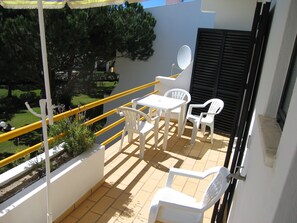 Balcony with dining area and views to the garden