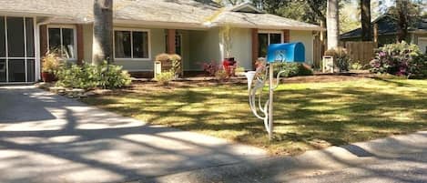 Historical oaks providing shade on the entire home, with manicured landscaping and plants!