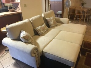 Family room sofa can be a comfortable bed.