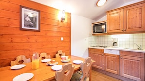 Prepare meals in the kitchenette and enjoy them at the dining table.