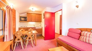 Prepare meals in the kitchenette and enjoy them at the dining table.