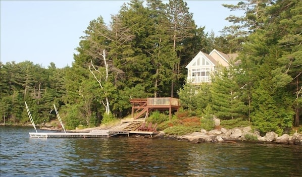 View of cottage and docks from the lake