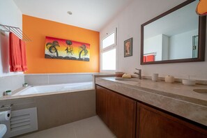 Master suite bathroom with shower and Jacuzzi tub