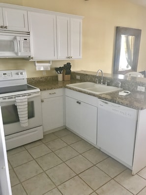 Fully equipped kitchen, w/ coffee pot, toaster, toaster oven, waffle maker, etc.