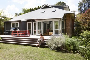 Large deck in beautiful garden setting