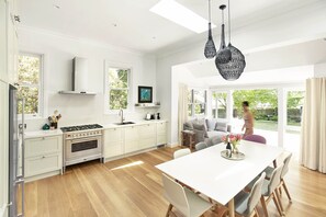 Open plan kitchen with eat in dining and sunroom at the rear