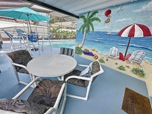 Relax in our tropical beach themed pool area