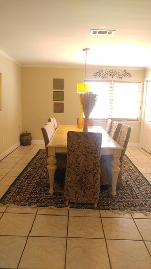 Kitchen table open to kitchen and living room 