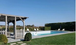 Newly renovated pool area (2020) with covered pergola