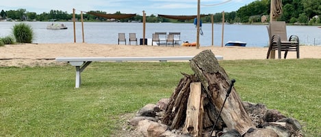 Private fire pit, beach, dock, and volleyball court.