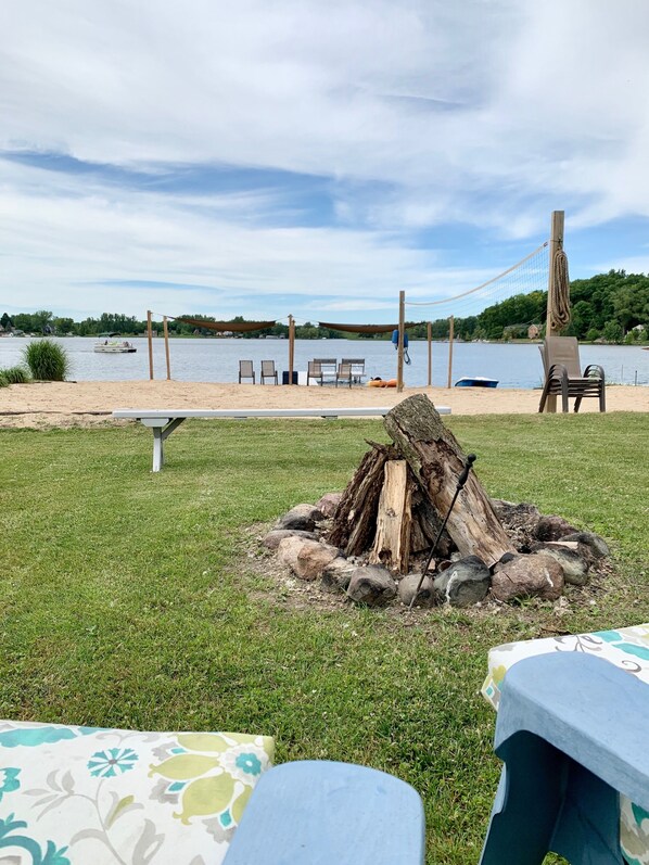 Private fire pit, beach, dock, and volleyball court.