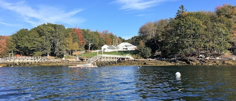 The property in early fall from the water of Linekin Bay