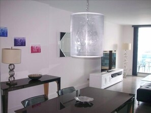 Living room with flat screen and dining area