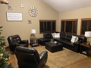 Main floor living room looking out towards community open space and park 