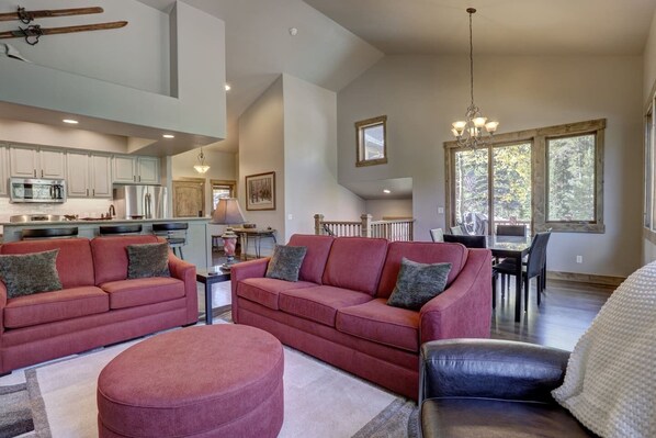 Open floor plan living room, dining area, and kitchen.