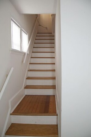 Stairs leading from foyer to apartment