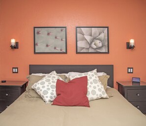 Features a queen mattress, dimmable sconces, and USB-equipped outlets.
