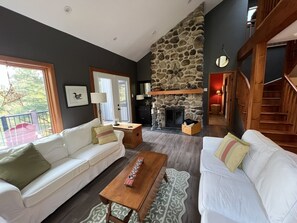 Warm & inviting, floor to ceiling traditional fireplace with natural gas fire