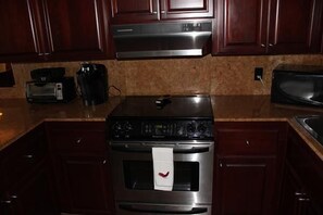 Kitchen with granite and hard wood cabinets