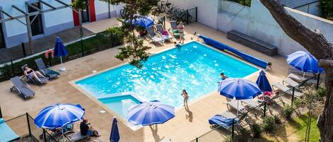 Lounge around the outdoor pool during summer!