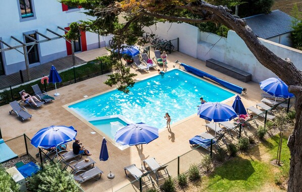 Lounge around the outdoor pool during summer!