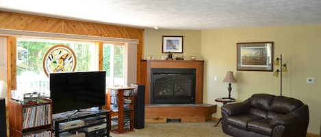 Sunken living room with fireplace 