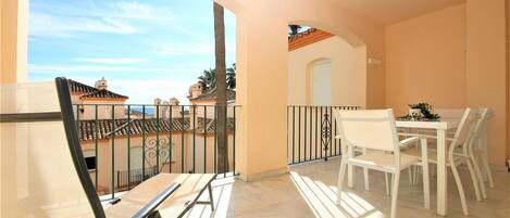 Large private balcony with extra outside dining area with seating for six and sea views