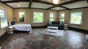 Main living space with queen bed and queen sleeper sofa.