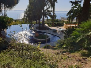 View of pool area from driveway above