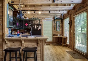 Pet Friendly Smoky Mountain Cabin "Papa's Pad" - Bar top and kitchen