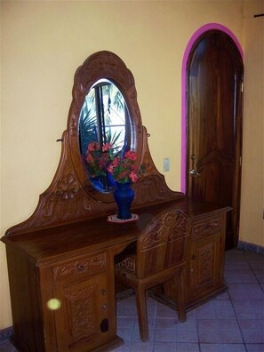Hand carved furniture with artistic details awaits you.