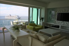 Living room and deck dinning set with stunning ocean, bay, & down town view!