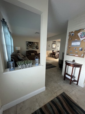 Entrance/foyer area looking into the front bonus room and dining area