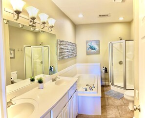 Freshen up for the day in the vibrant en-suite bathroom