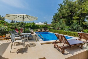 24m2 swimming pool with sundeck area overlooking the pine woods and garden