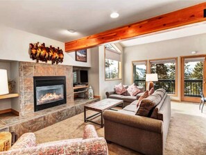 Fireplace in large living room as well as a pull out queen sofa bed