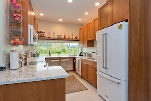 Kitchen has French door refrigerator 