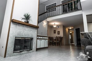 Living room, dining room and view to upstairs bedroom and bath.