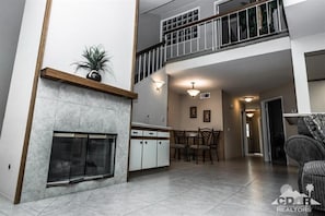 Living room, dining room and view to upstairs bedroom and bath.